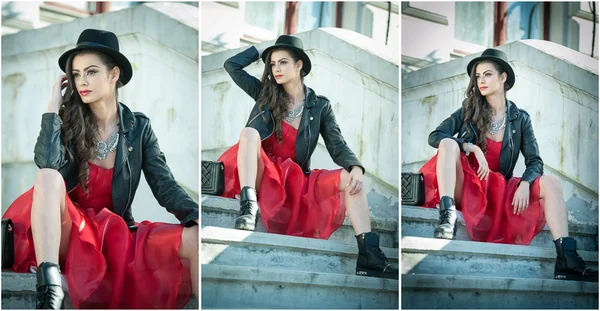 Beautiful woman with black hat, red dress and boots posing sitting on stairs. Young brunette spending time during autumn. Long hair attractive girl with creative makeup and red dress, outdoors shot — Stock Photo, Image