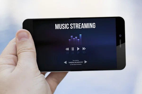 Music streaming on cell phone screen — Stock Photo, Image