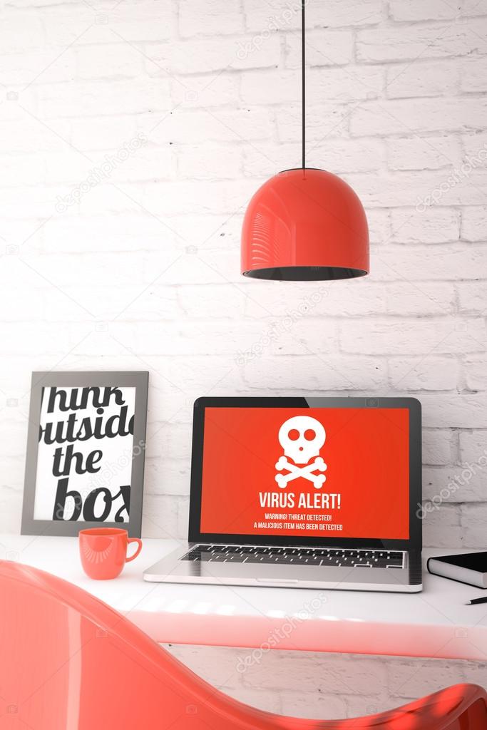 desktop with laptop showing virus alert