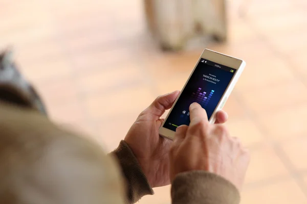 Man touching screen of smartphone — Stock Photo, Image