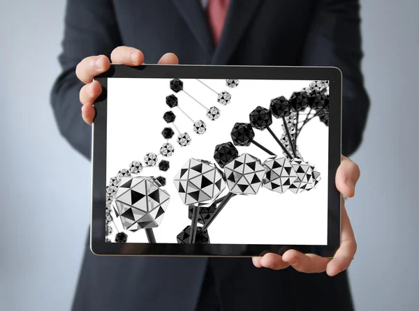 Affärsman med dna på Tablet PC-skärmen — Stockfoto