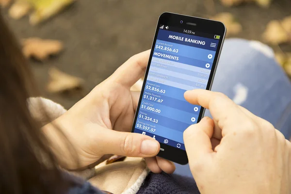 Woman holding smartphone with banking app — Stock Photo, Image