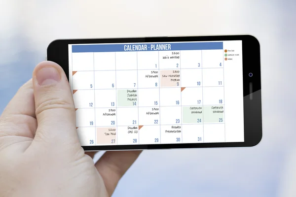 Hand met kalender planner — Stockfoto