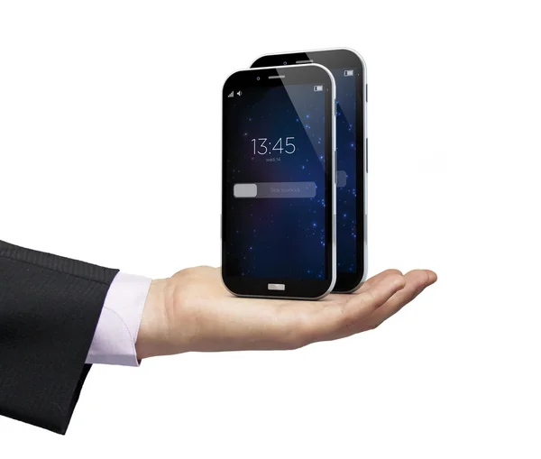 Smartphones über einer Hand — Stockfoto