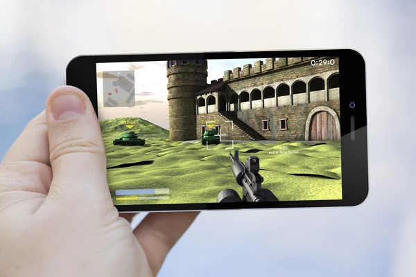 Smartphone con videojuego en la pantalla — Foto de Stock