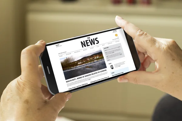 Smartphone with news publication on screen — Stock Photo, Image