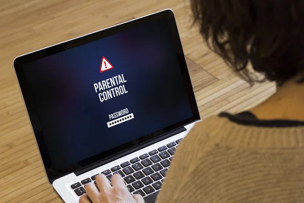 Woman using computer with parental control — Stock Photo, Image