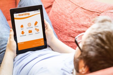 man with online learning platform on a tablet