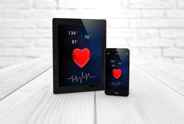 Smartphone and tablet with health app on screen — Stockfoto