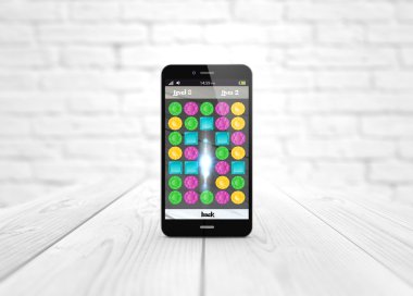 Beyaz ahşap zemin üzerinde oyun smartphone