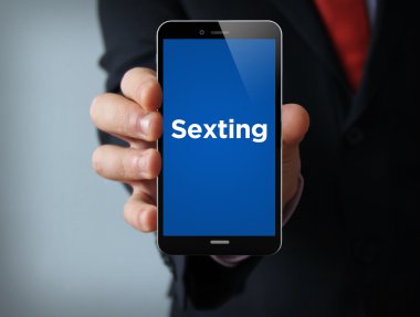 businessman holding smartphone with sexting app clipart