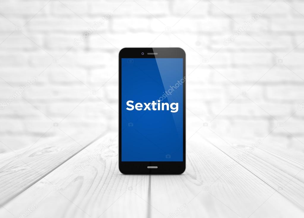 smartphone on white wooden background with sexting app