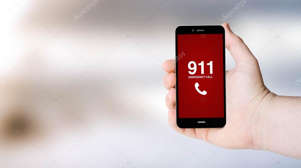 911 sign on smartphone screen on user's hand