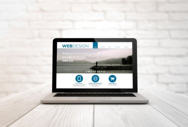 laptop with webdesign website on the screen