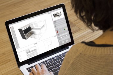 woman with computer modelling a house