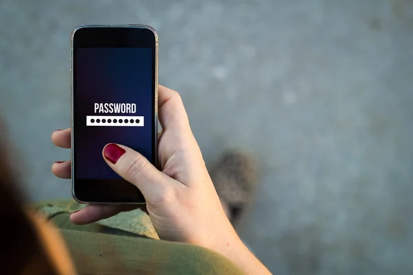 Woman walking with smartphone  password — Stock Photo, Image