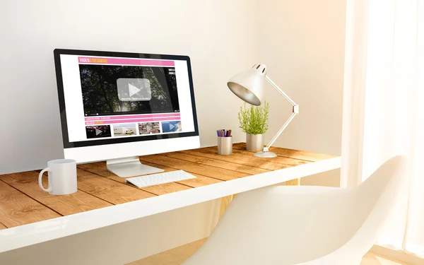 Minimalist workplace with video streaming computer — Stok fotoğraf