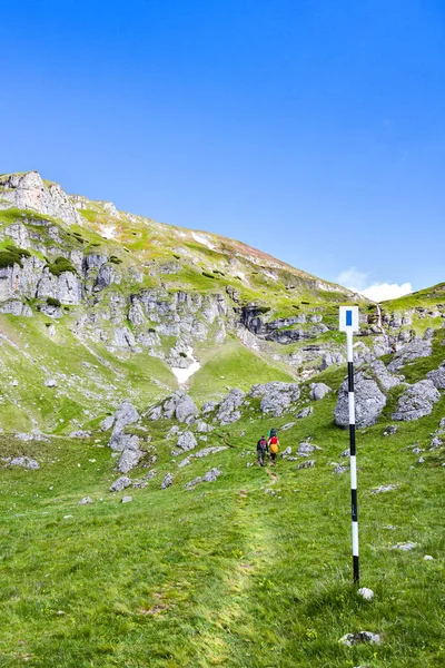 Hikers on the Bucegi mountains in Romania Royalty Free Stock Images