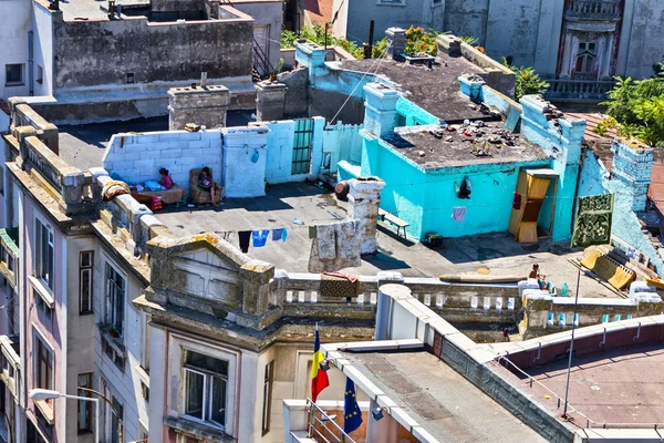 Gipsy kids on the old building roof Royalty Free Stock Photos