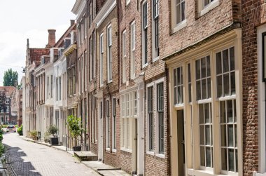 Middelburg, the Netherlands, July 25, 2021: picturesque street with brick facades in the old town on a sunny day