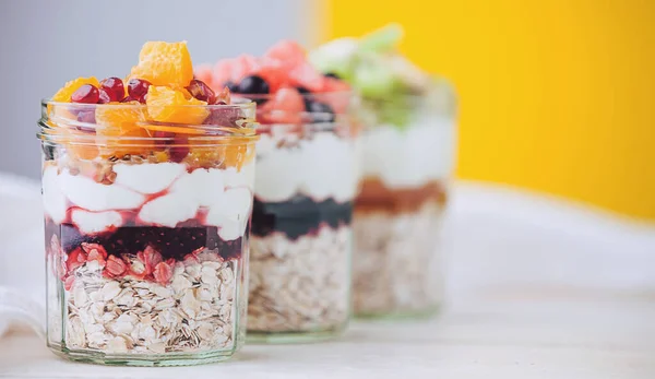 Oatmeal with fruit and cereals in a glass jar