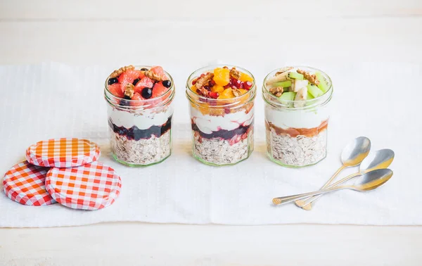 Oatmeal with fruit and cereals in a glass jar