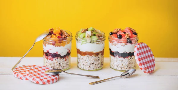 Oatmeal with fruit and cereals in a glass jar