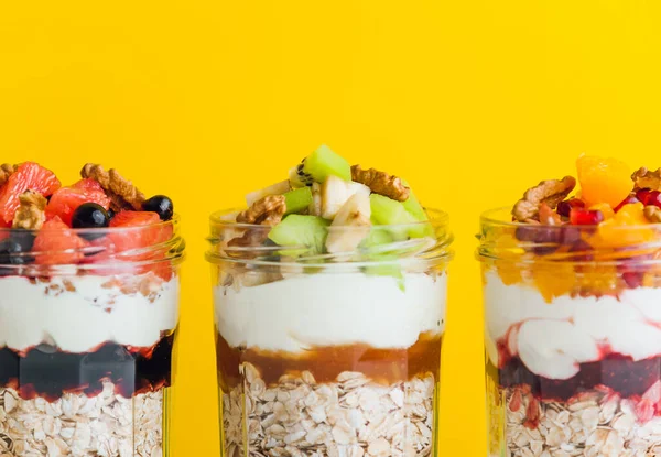 Oatmeal with fruit and cereals in a glass jar