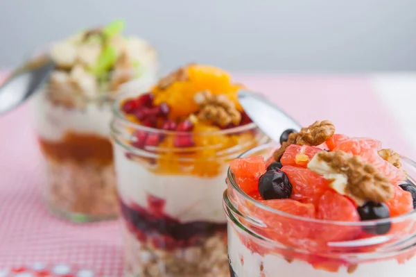 Oatmeal with fruit and cereals in a glass jar