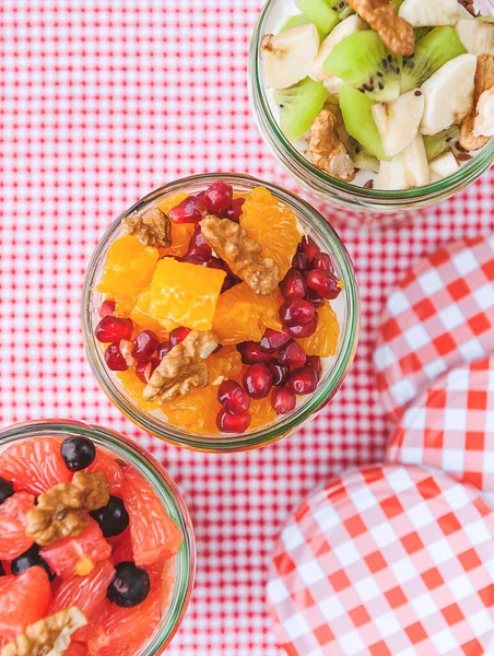 Oatmeal with fruit and cereals in a glass jar