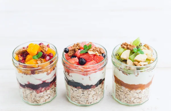 Oatmeal with fruit and cereals in a glass jar