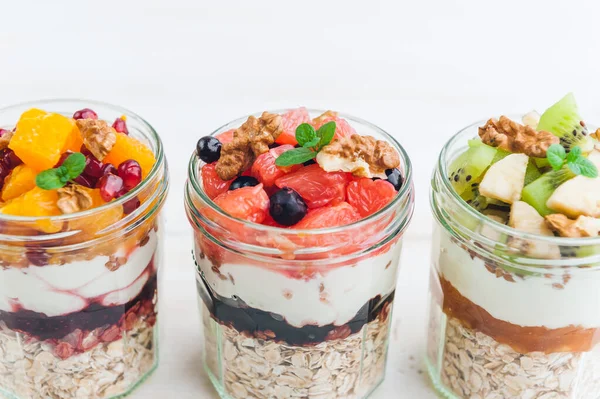 Oatmeal with fruit and cereals in a glass jar