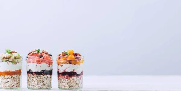 Oatmeal with fruit and cereals in a glass jar