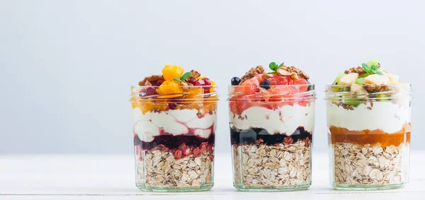 Oatmeal with fruit and cereals in a glass jar