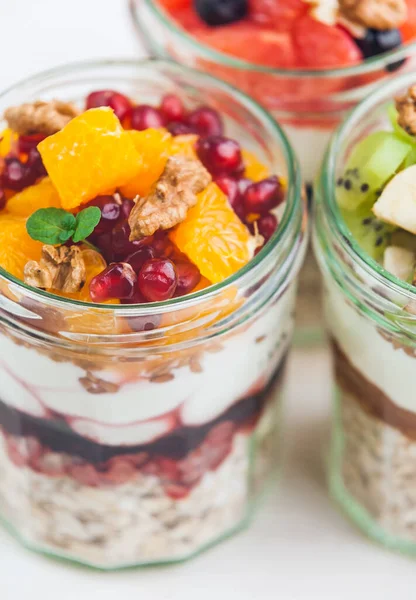 Oatmeal with fruit and cereals in a glass jar