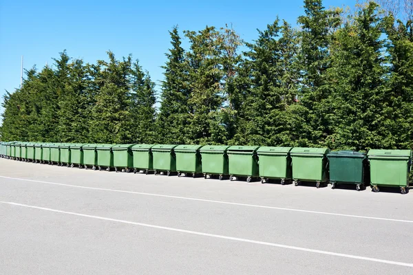 Long row of garbage cans in park — Stock Photo, Image