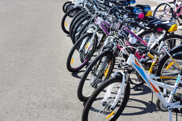 Walking bikes for rent on city street — Stock Photo, Image