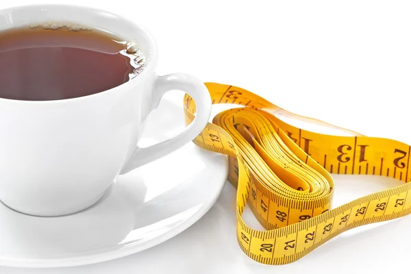 Cup of hot tea with tape measure — Stock Photo, Image