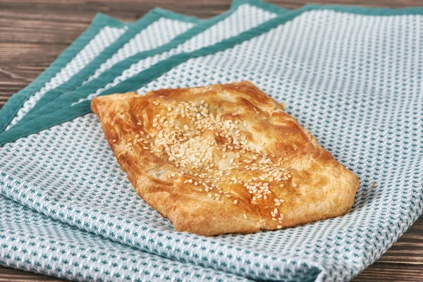 Pie with caraway on napkin — Stock Photo, Image