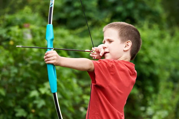 Little archer with bow and arrow — Stock Photo, Image