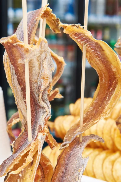 Dried fish on wooden stick — Stock Photo, Image