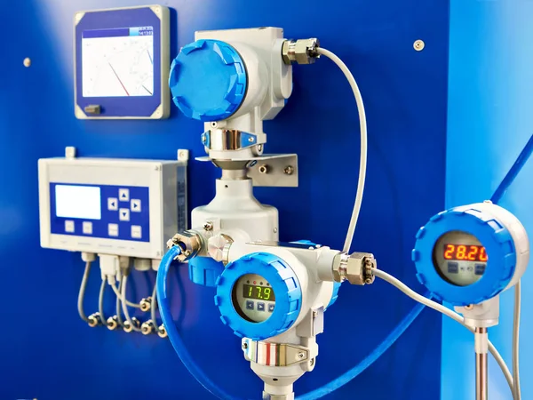 Electronic digital pressure gauge and water flow calculation equipment at an industrial exhibition