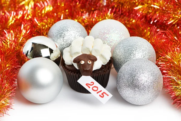 Cake lamb with silver Christmas balls and tinsel as simbol 2015 — Stock Photo, Image