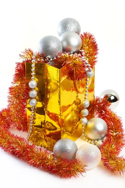 Christmas balls and tinsel in gift bag New Year isolated — Stock Photo, Image