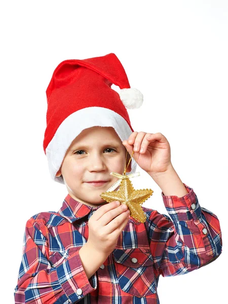 Little boy in red Santa hat with golden star — Stock Photo, Image