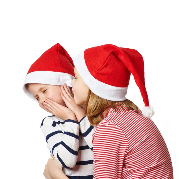 Girl and little boy in Santa Claus hat — Stock Photo, Image