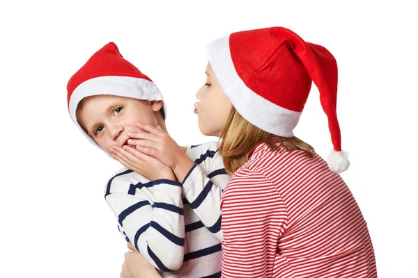 Fille et petit garçon dans le chapeau du Père Noël — Photo