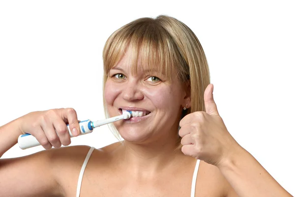 Happy woman brushing teeth and thumbs up sign ok isolated — Stock Photo, Image