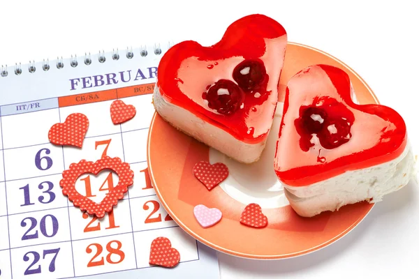 Two jelly heart-shaped cakes and calendar — Stock Photo, Image