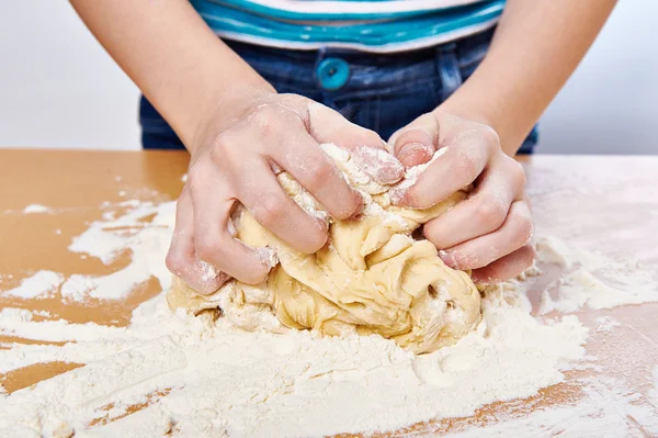 Kneading dough on girl hands — Stock Photo, Image